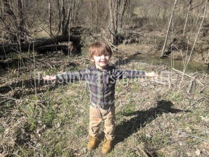 child excited after finding the creek