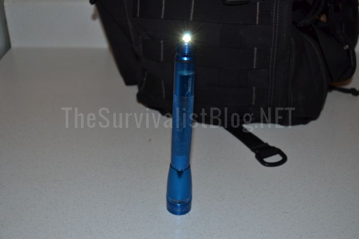 maglite in front of backpack