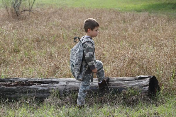 boy wearing camouflage clothes