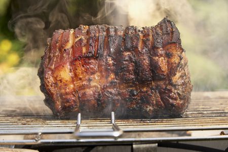 using a meat smoker on a pork