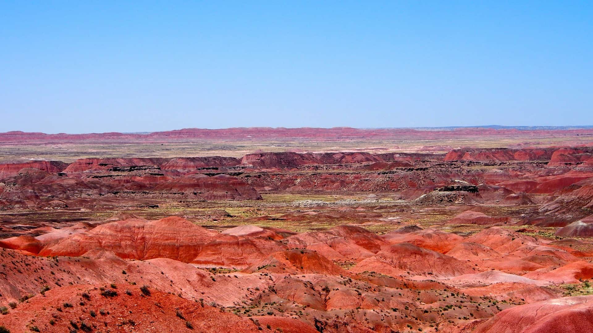 blue sky with the red horizon of the painted desert in Arizona