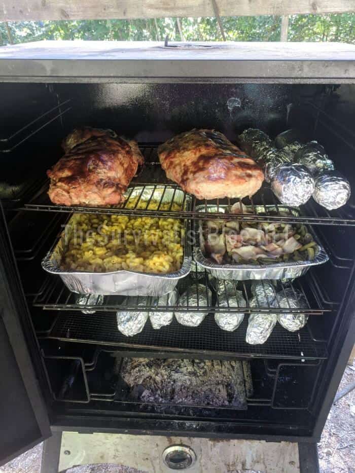 foods cooking in a smoker