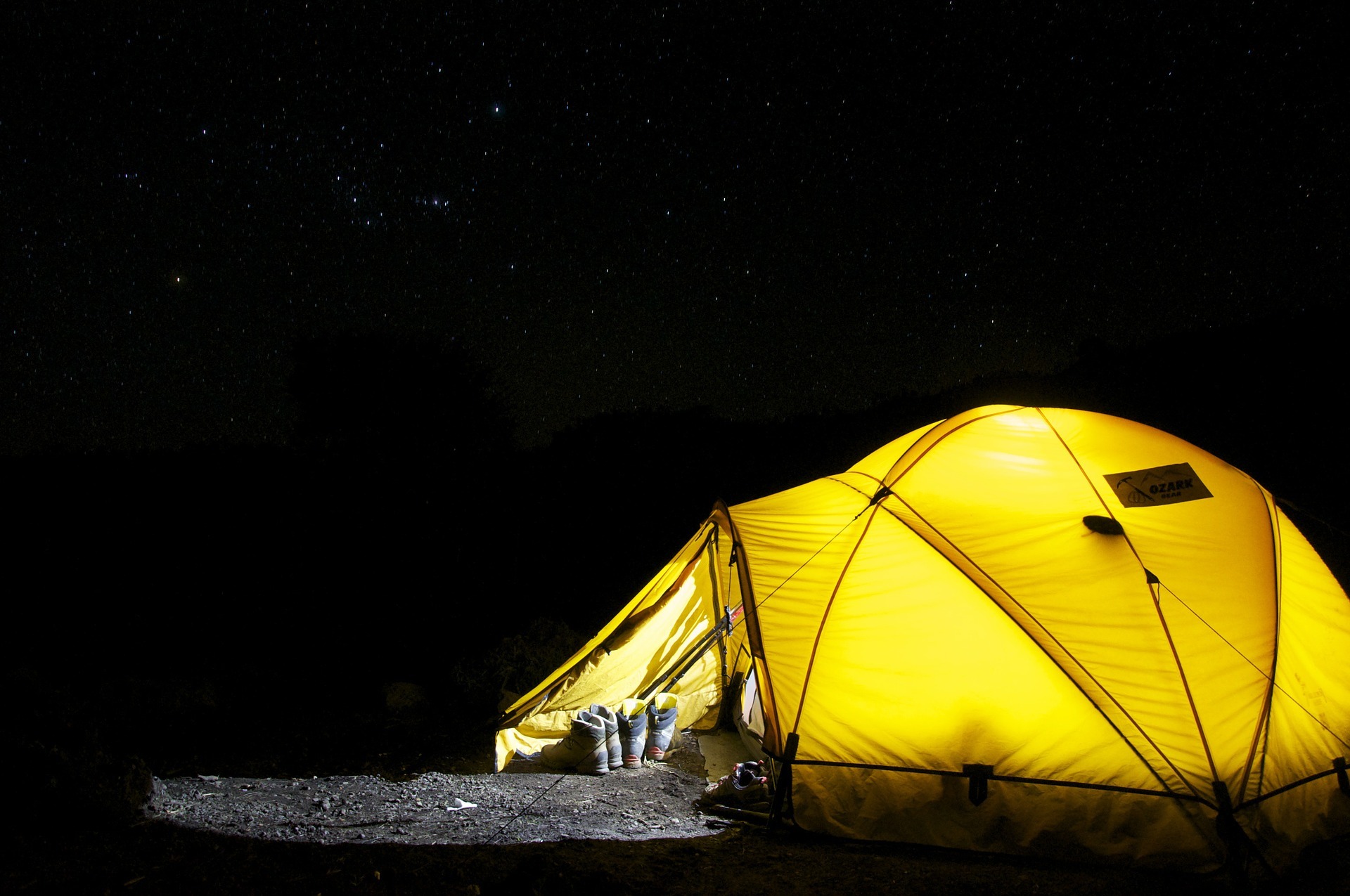 Camping tent placed underneath the stars