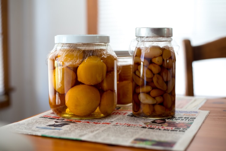 Canned goods inside the jars and a newspaper