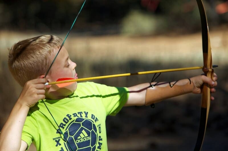 child shooting a bow