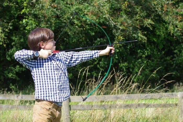 boy shooting a bow