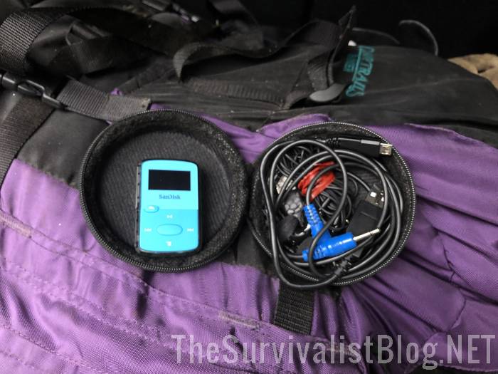 electronics pouch with Sony MP3 player and various cables