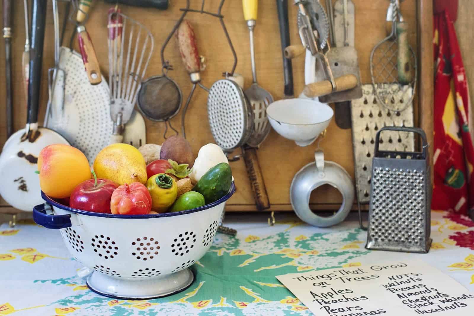 kitchen items and basket with veggies