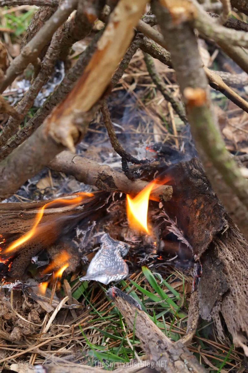 duct tape burning as tinder under outdoor fire