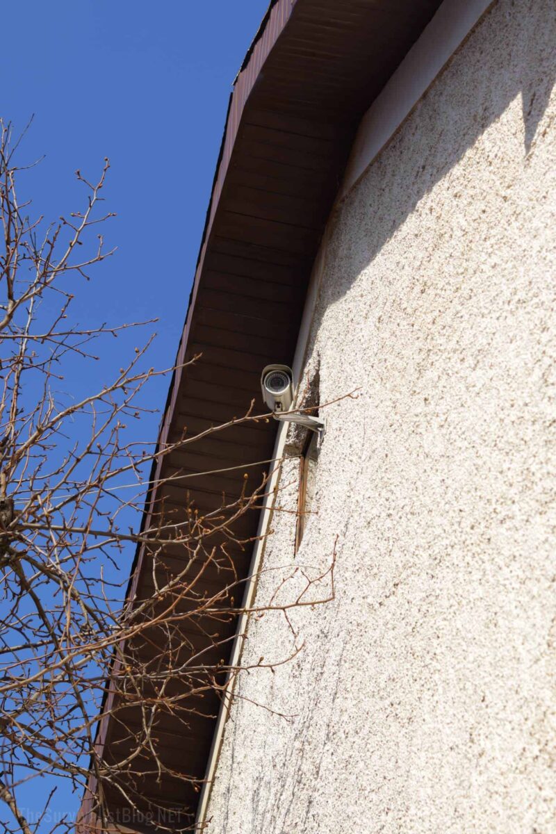 security camera on house exterior wall