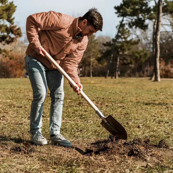 a man digging a hole