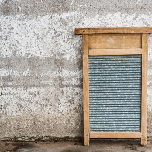using a washboard to wash clothes without electricity
