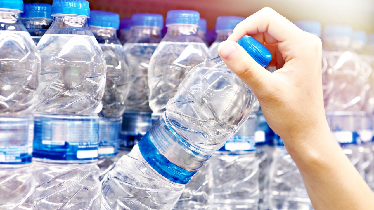 Water plastic bottle in hand