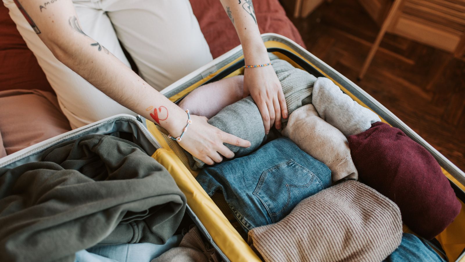 packing clothes in a suitcase