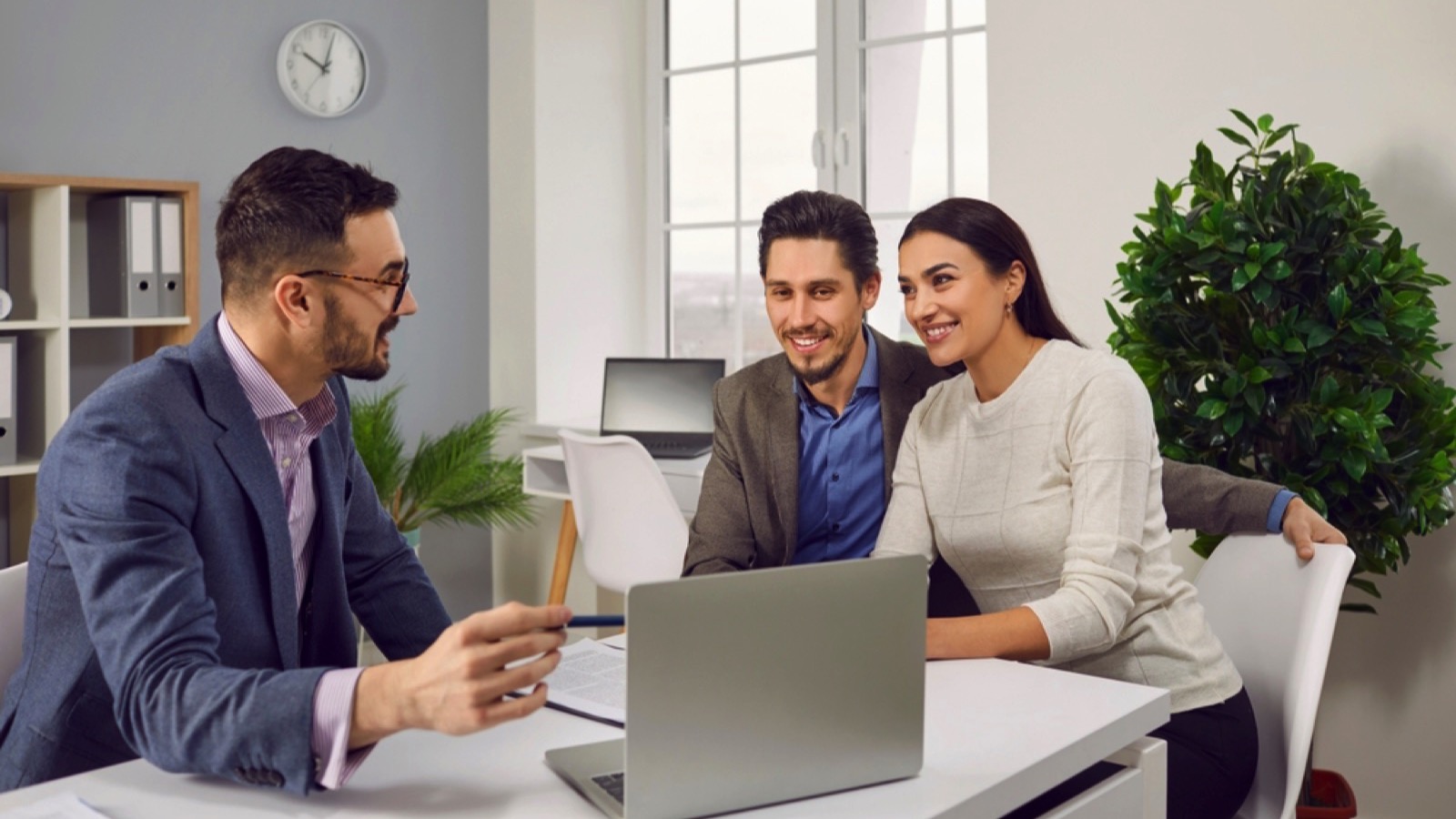 Couples talking to insurance agent