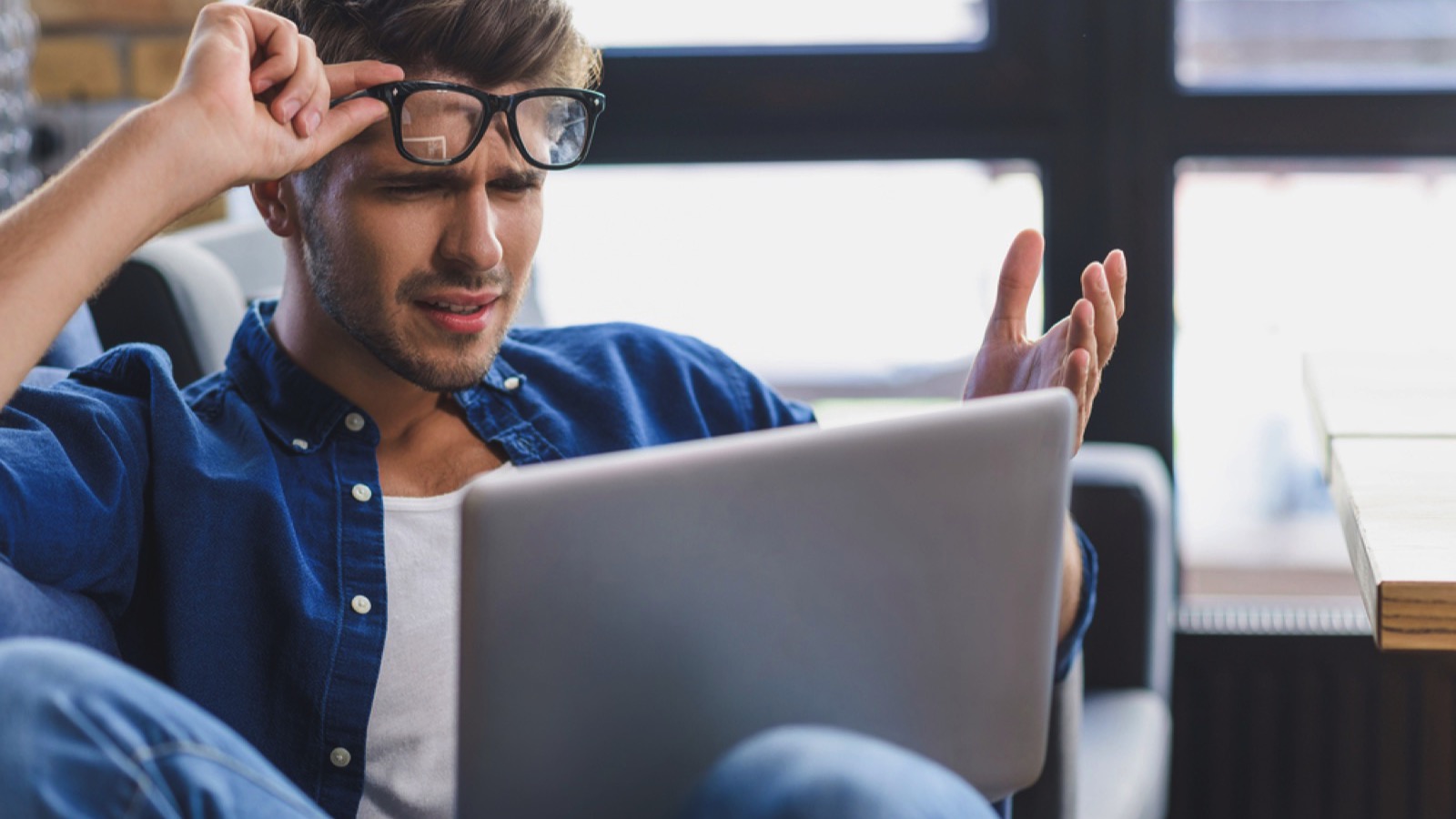 Man working in computer irritated