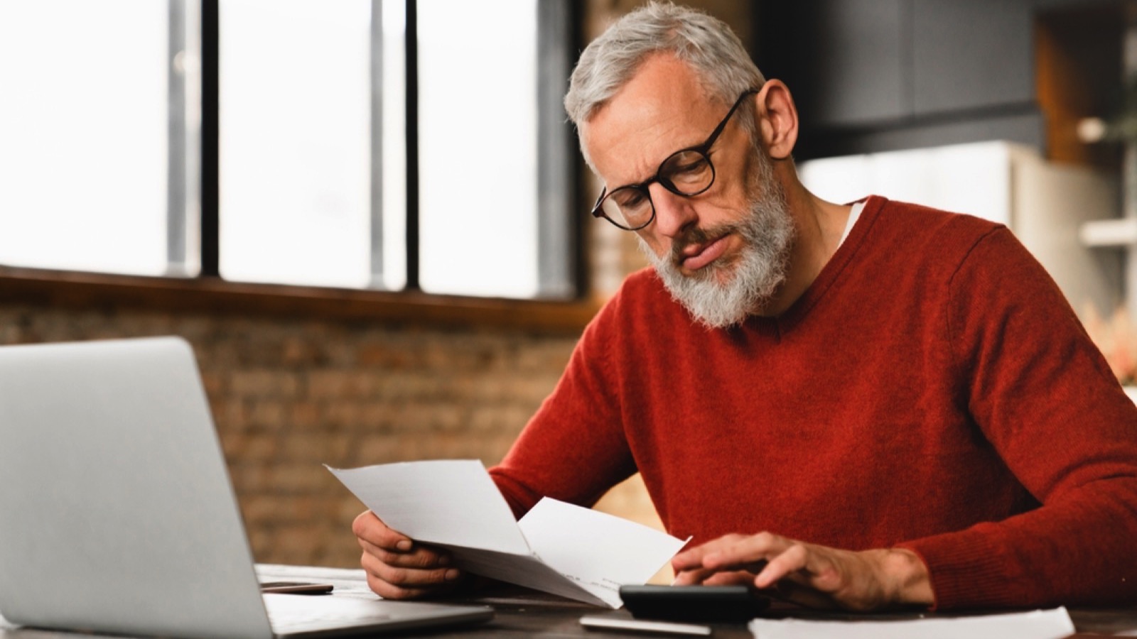 Middle aged man planning for tax benefits