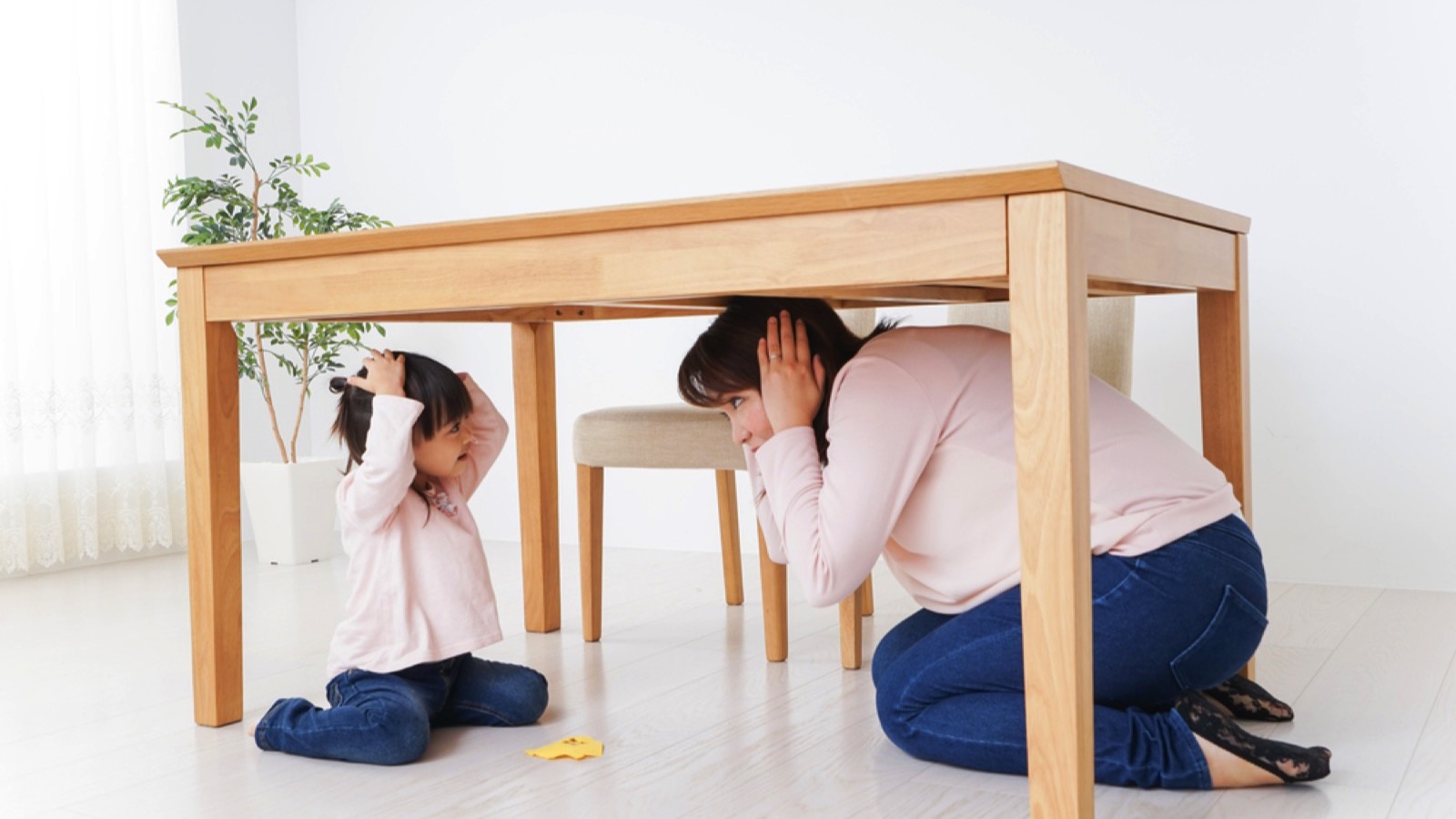 Mother and child practicing emergency drill