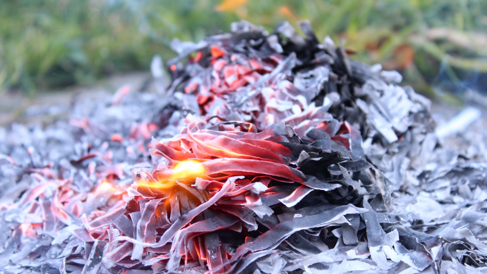 setting fire to shredded paper