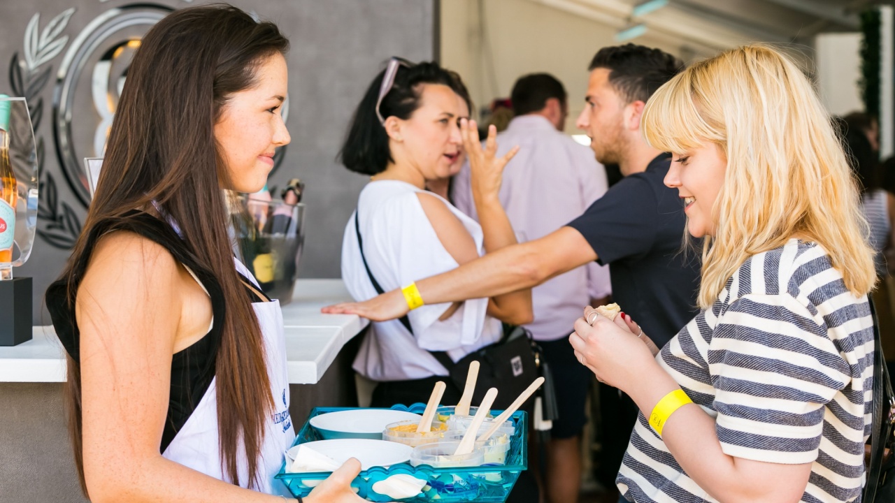 People sampling free snacks and generally enjoying a day out at a Food and Wine Fair