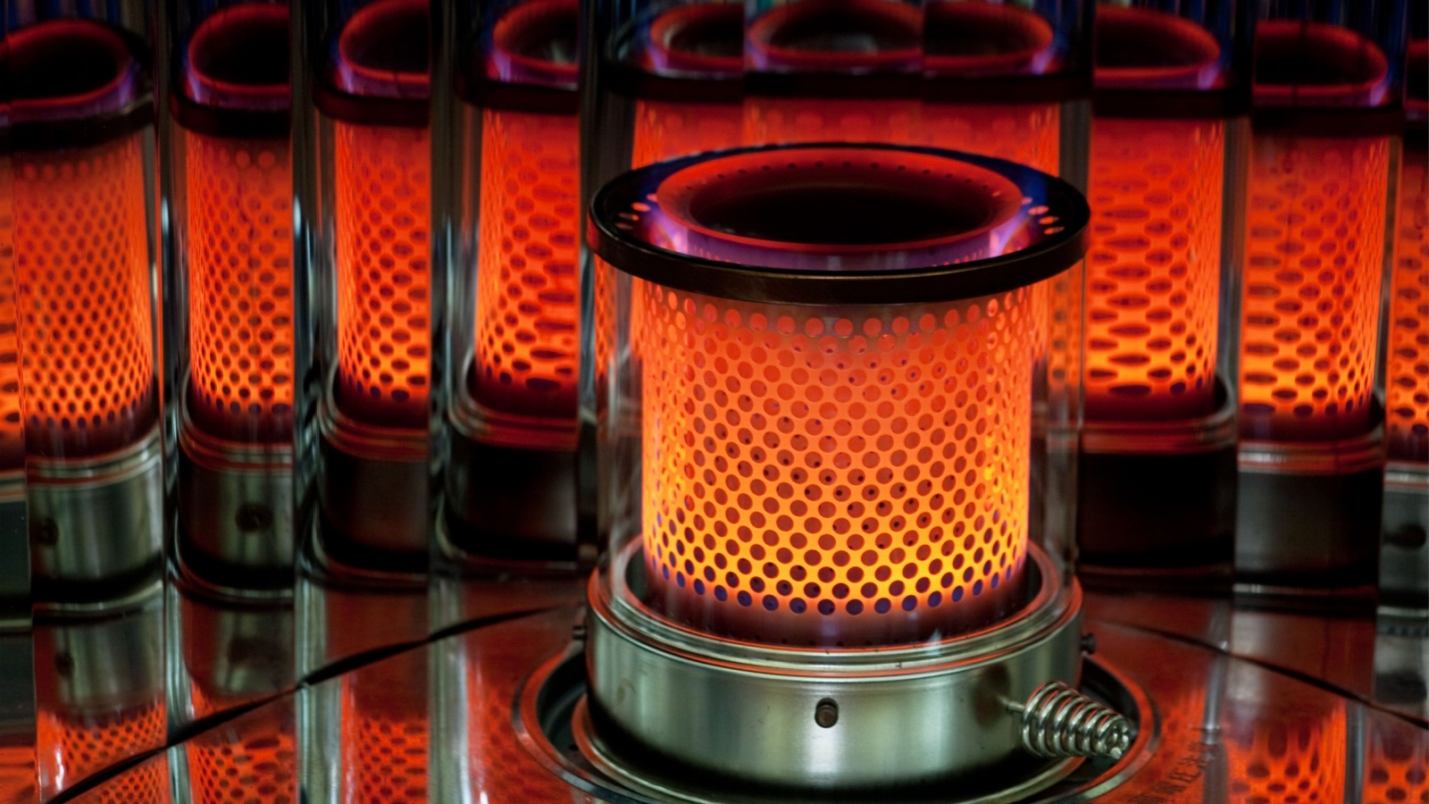 Red flame of oil heater. Kerosene heater; oil stove.