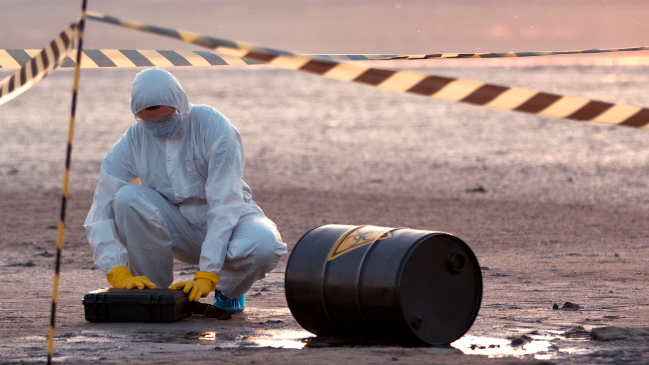 A scientist in a protective suit works in a biological contamination zone.