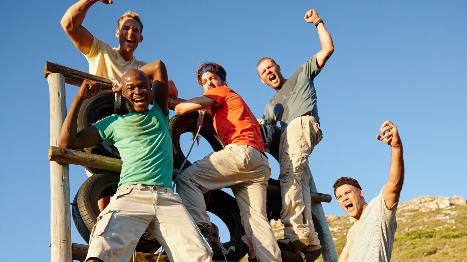 Bootcamp conquerers. Portrait of a group of men happy to have survived bootcamp. team work