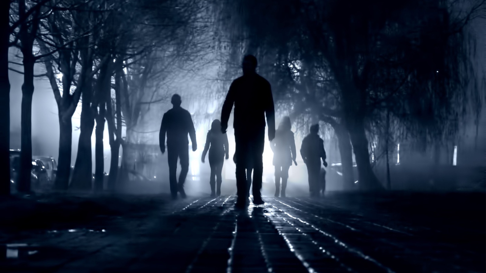 group of people walking in the dark, suspicious, gang