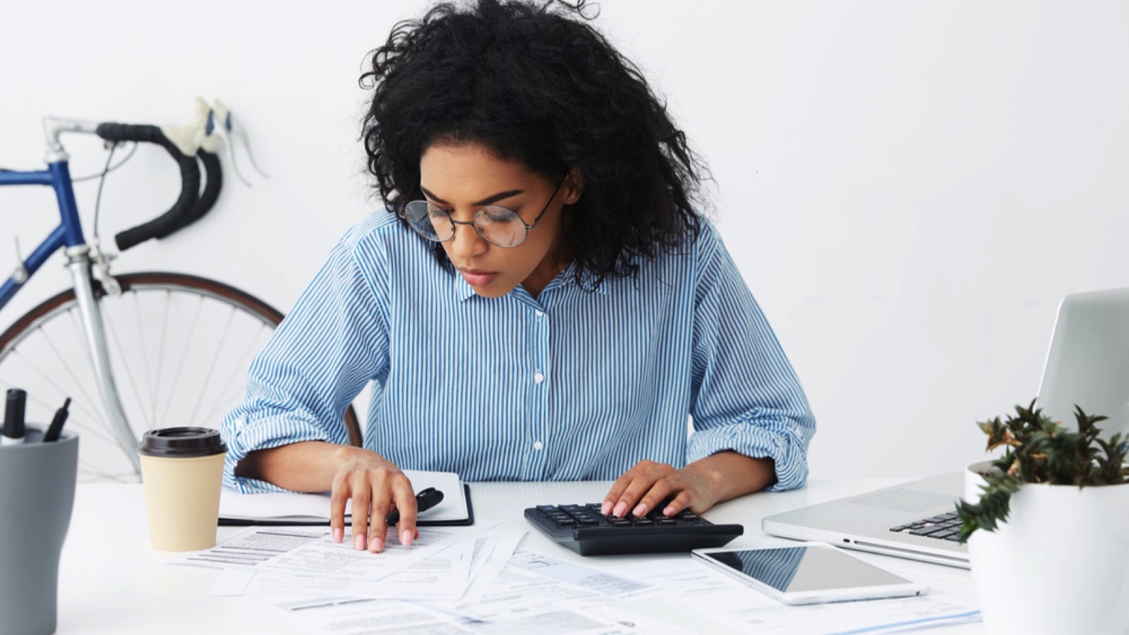 Young african Woman doing budget