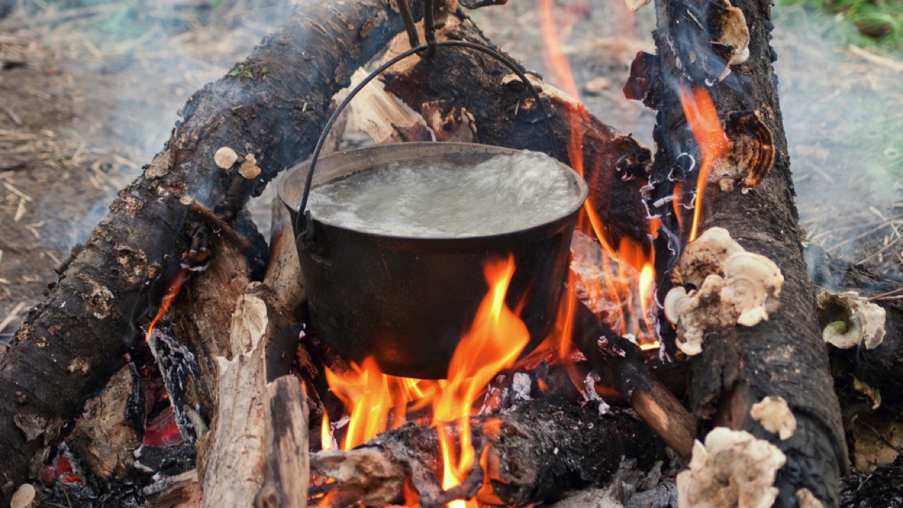 Boiling water in the bowler on the bonfire