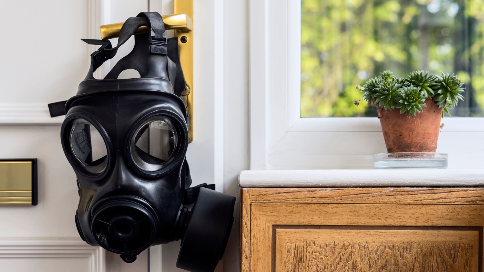 gas mask hanging off the entry door handle. Home isolation.