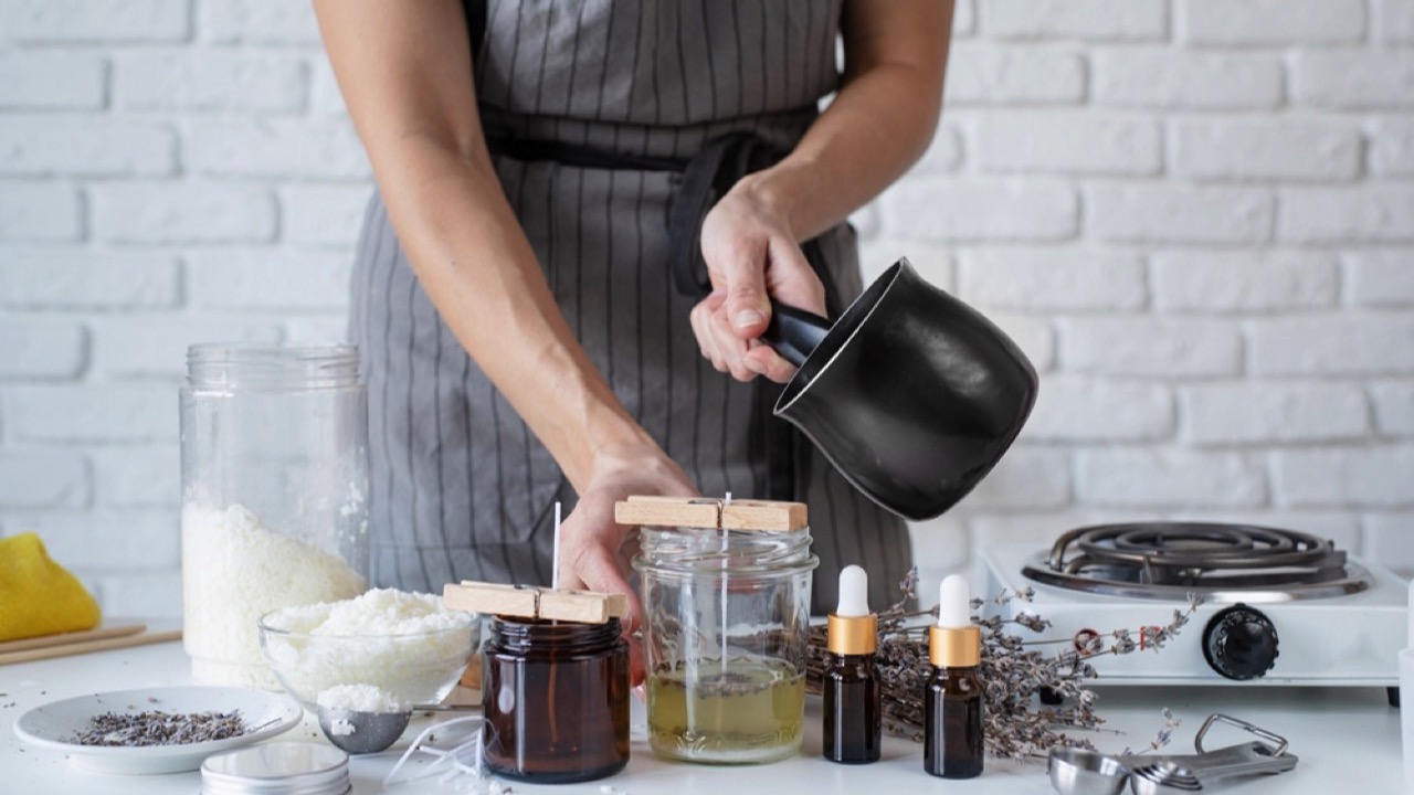 Woman making candles