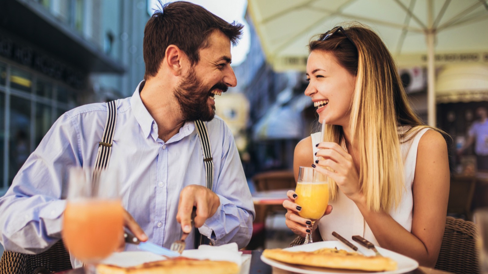 Happy couples eating in restaurant