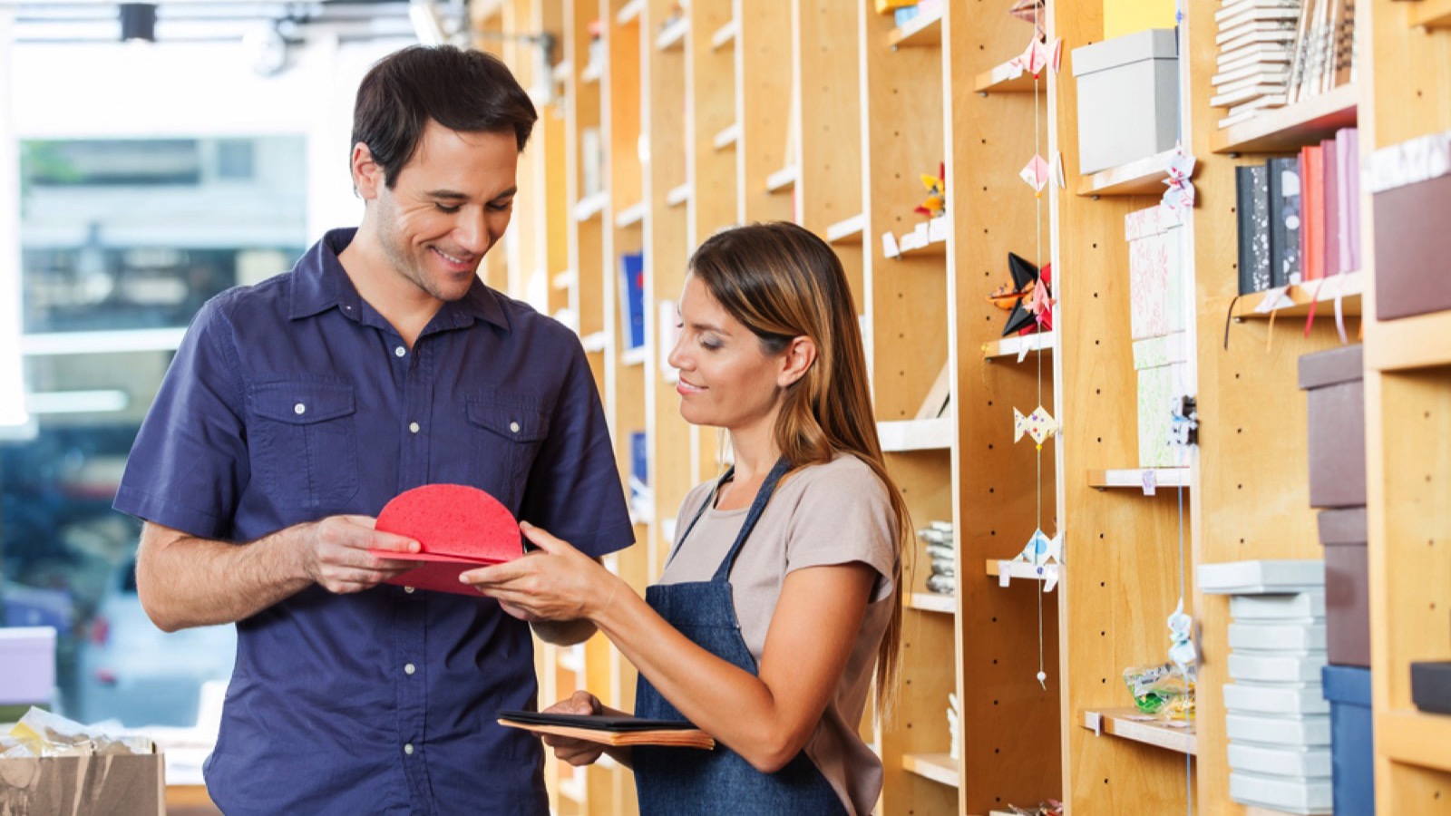 Man buying greeting card in shop