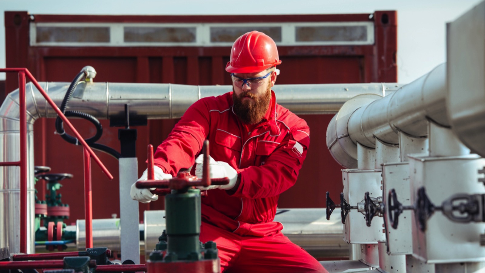 Oil Rig Worker turning on oil rig