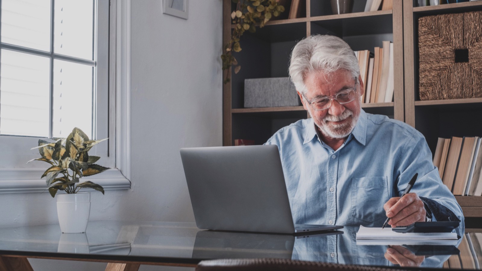 Old man working in office