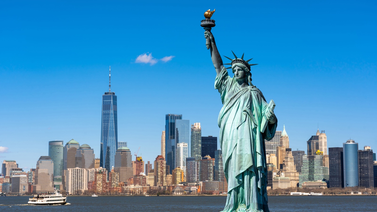 The Statue of Liberty over the Scene of New york cityscape river side which location is lower manhattan,