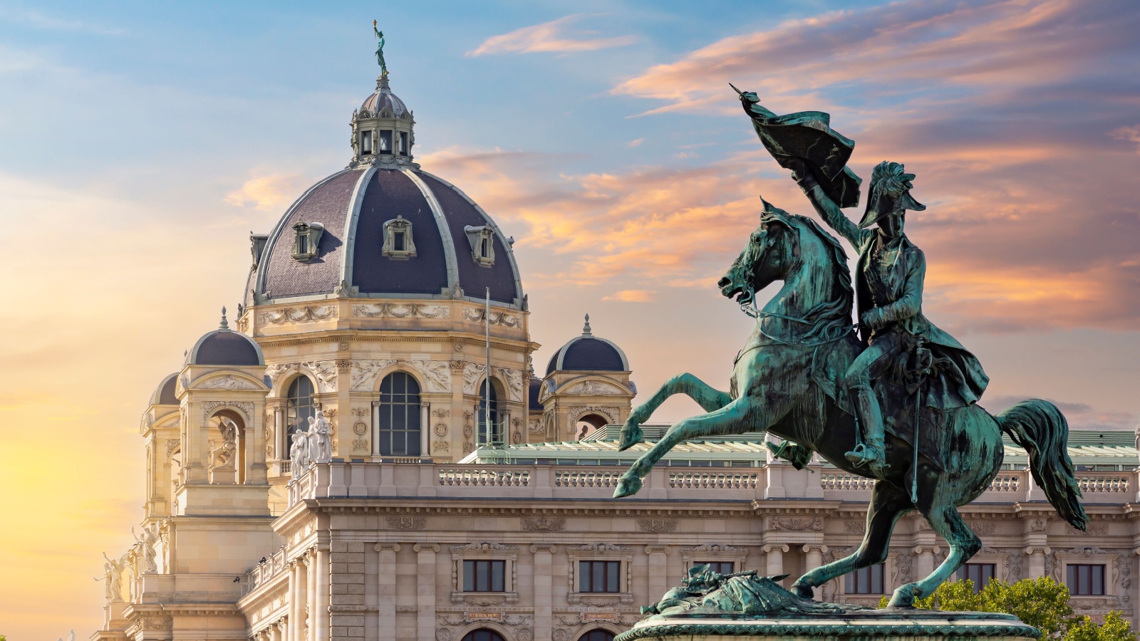 Statue of Archduke Charles on Heldenplatz square and Museum of Natural History dome at sunset, Vienna, Austria