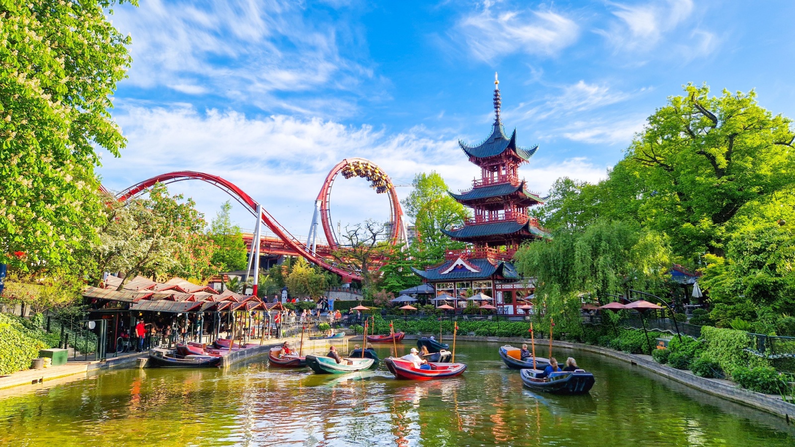 Tivoli Gardens is Copenhagen's famous and magical theme park, located right in the heart of the city. It is the third-oldest operating amusement park in the world