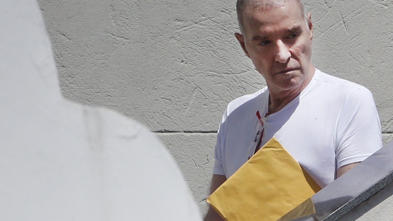 Brazilian bilionaire Eike Batista leaves the Federal Police headquater after declare in a bribe scandall.