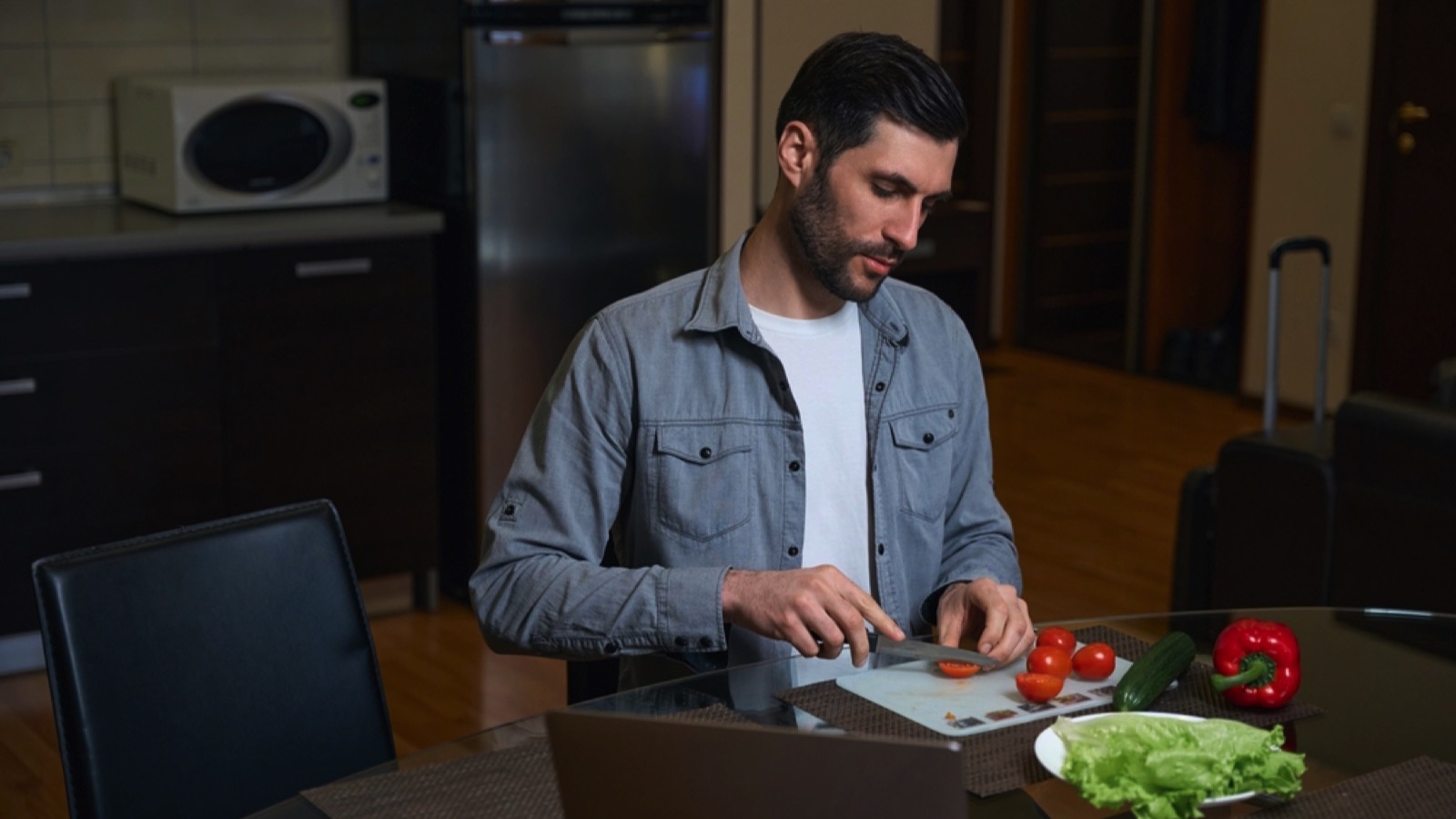 Traveler cooking in hotel room