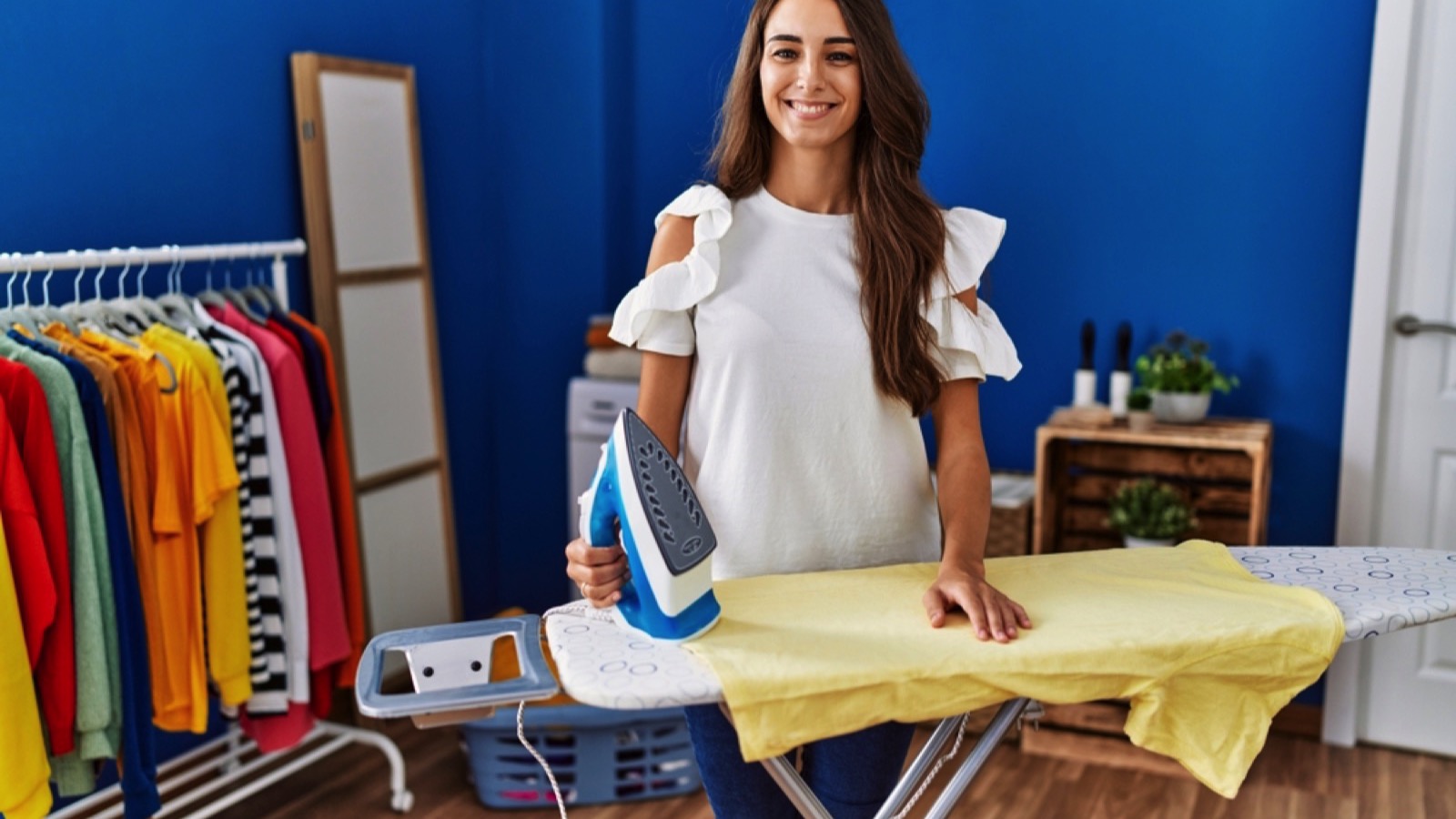 Woman ironing her shirt