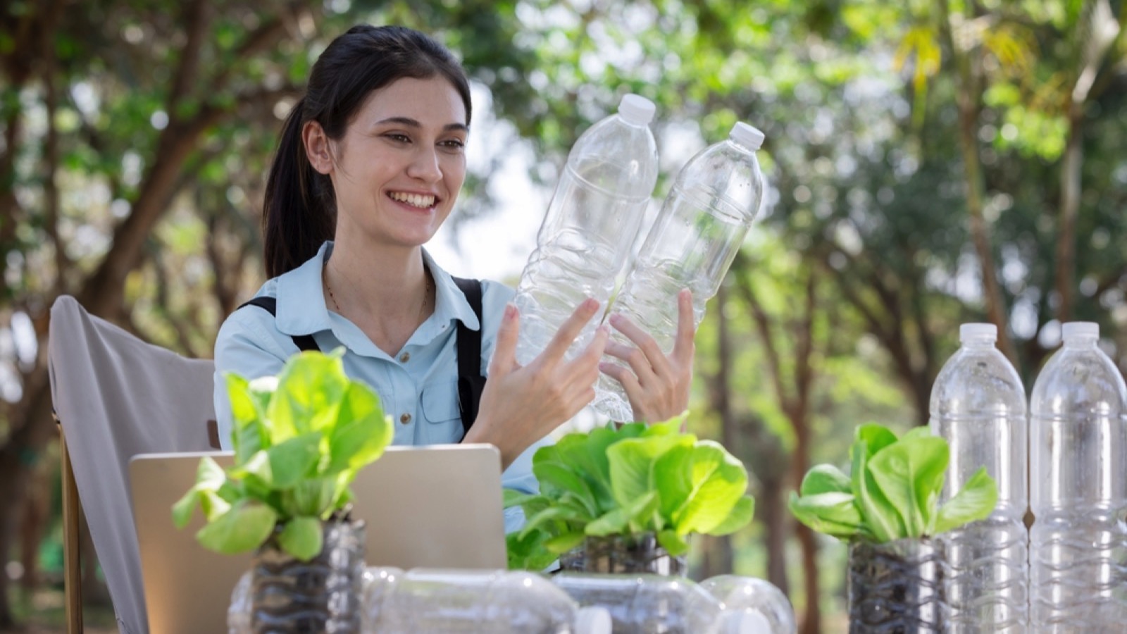 Woman recycling with plastic bottle